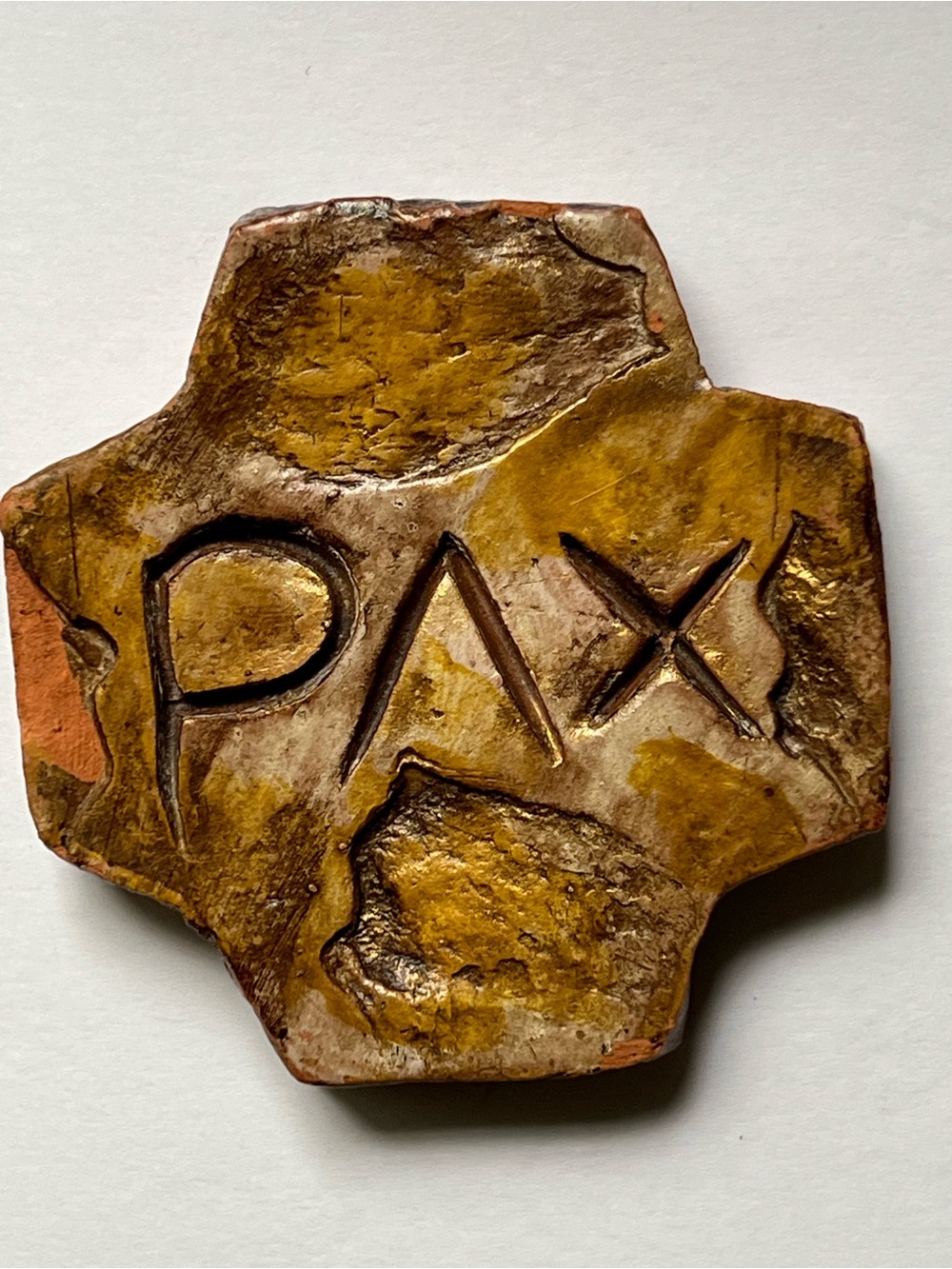 Square cross hand carved PAX( peace)  in terra-cotta with rustic stone finish